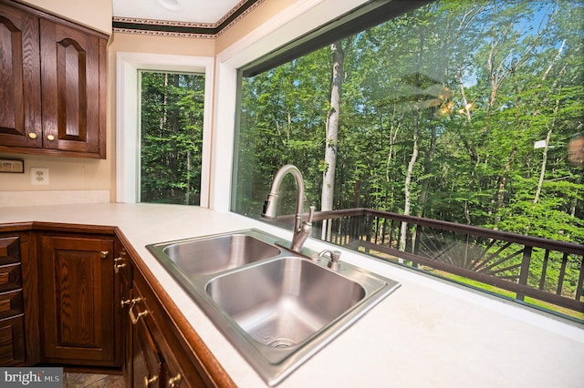 5599 Small Oak Ct, Woodbridge, VA 22192 - kitchen with light countertops and dark brown cabinetry