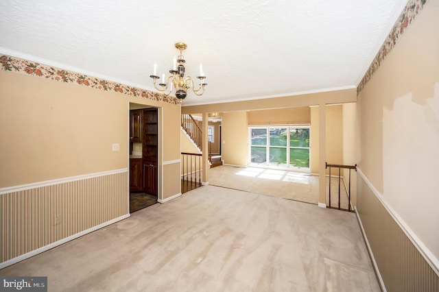 5599 Small Oak Ct, Woodbridge, VA 22192 - empty room featuring a chandelier, ornamental molding, and carpet