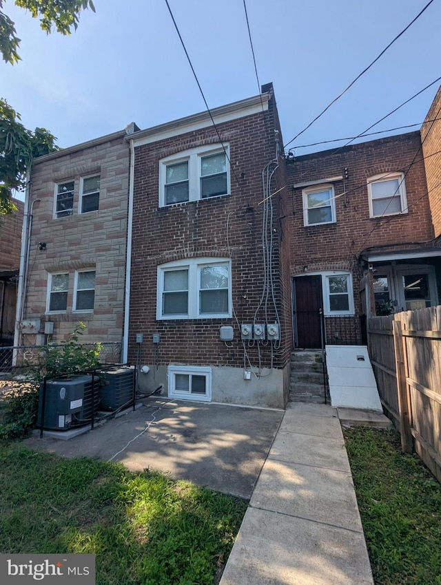 1625 Spruce, Baltimore City, MD 21226 - view of front of property with brick siding and a patio