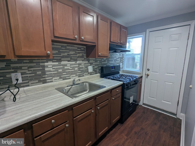 1625 Spruce, Baltimore City, MD 21226 - kitchen with black range with gas stovetop, under cabinet range hood, light countertops, and decorative backsplash