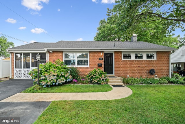 6402 Virginia Hills Ave, Alexandria, VA 22310 - ranch-style house featuring brick siding, a front yard, a chimney, a sunroom, and roof with shingles