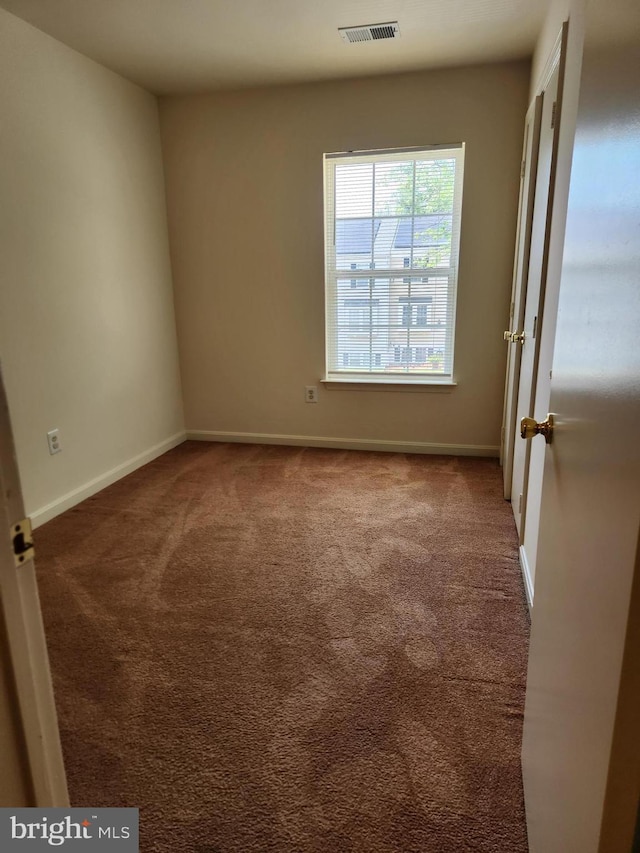 938 Newington Ct, Capitol Heights, MD 20743 - unfurnished room with carpet floors and baseboards