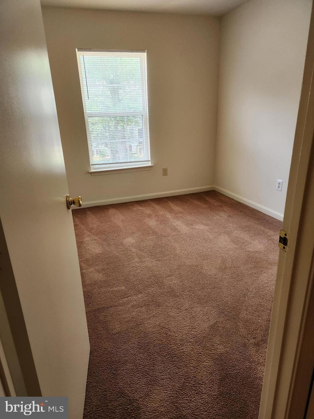 938 Newington Ct, Capitol Heights, MD 20743 - carpeted spare room with baseboards