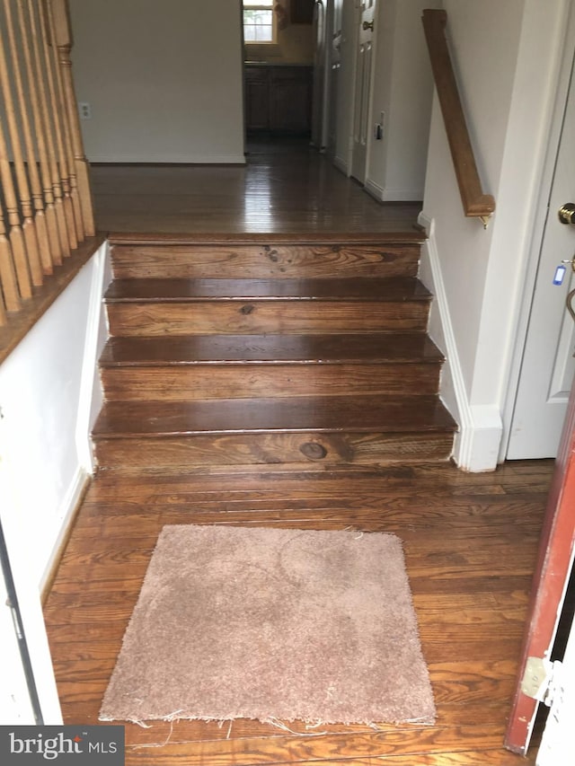 938 Newington Ct, Capitol Heights, MD 20743 - stairs featuring hardwood / wood-style floors and baseboards