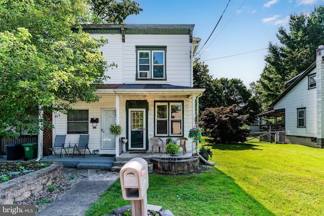 121 Spruce St, Carlisle, PA 17013 - view of front of home with covered porch and a front lawn