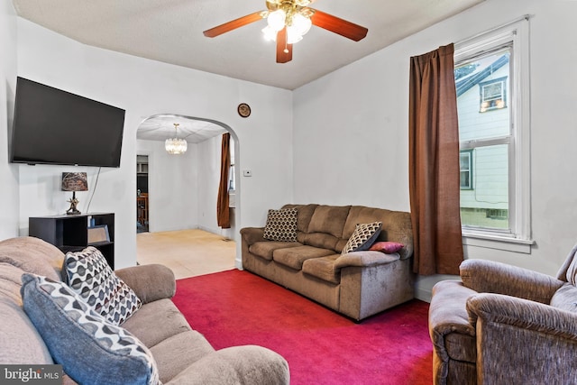 121 Spruce St, Carlisle, PA 17013 - carpeted living area featuring arched walkways, ceiling fan, and a chandelier