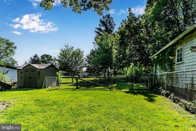 121 Spruce St, Carlisle, PA 17013 - fenced backyard featuring a storage unit and a gate
