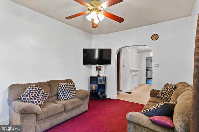 121 Spruce St, Carlisle, PA 17013 - carpeted living area featuring arched walkways and a ceiling fan