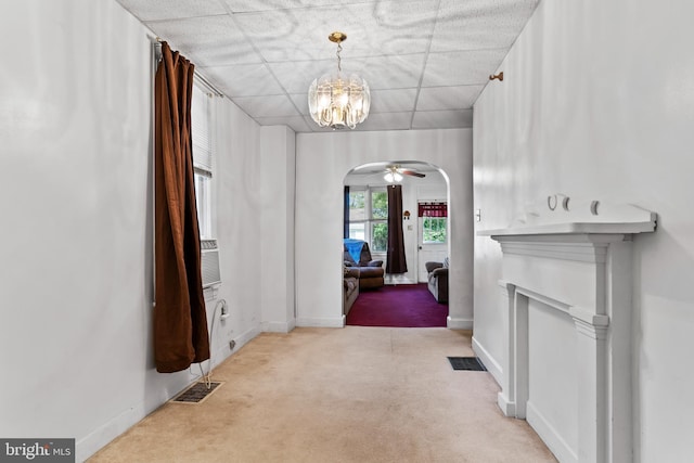 121 Spruce St, Carlisle, PA 17013 - hall with arched walkways, light colored carpet, and a chandelier