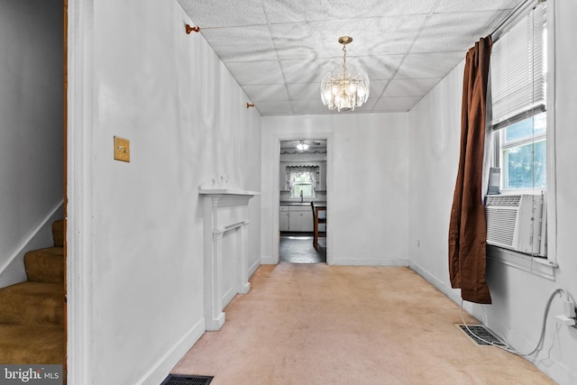 121 Spruce St, Carlisle, PA 17013 - hallway featuring light carpet, a chandelier, stairs, and cooling unit