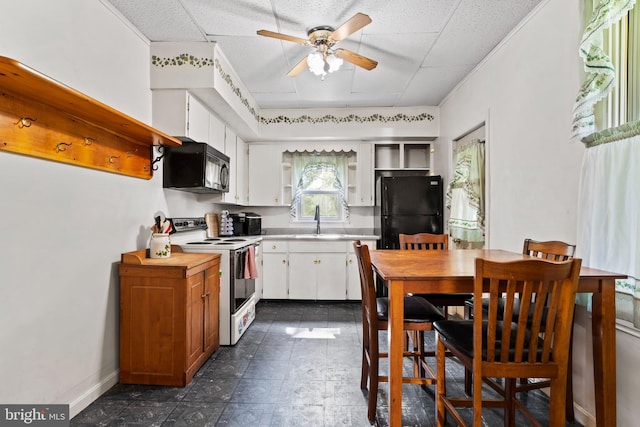 121 Spruce St, Carlisle, PA 17013 - kitchen with black appliances, a ceiling fan, open shelves, a paneled ceiling, and white cabinets