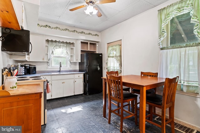 121 Spruce St, Carlisle, PA 17013 - kitchen featuring freestanding refrigerator, white electric range oven, ceiling fan, open shelves, and white cabinetry
