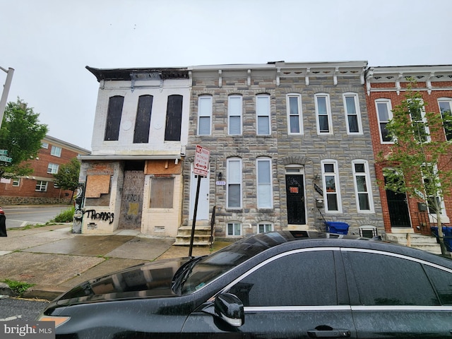 1703 Baker St, Baltimore, MD 21217 - townhome / multi-family property featuring entry steps and stone siding