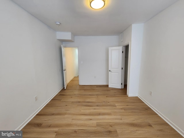 1703 Baker St, Baltimore, MD 21217 - spare room featuring light wood finished floors and baseboards