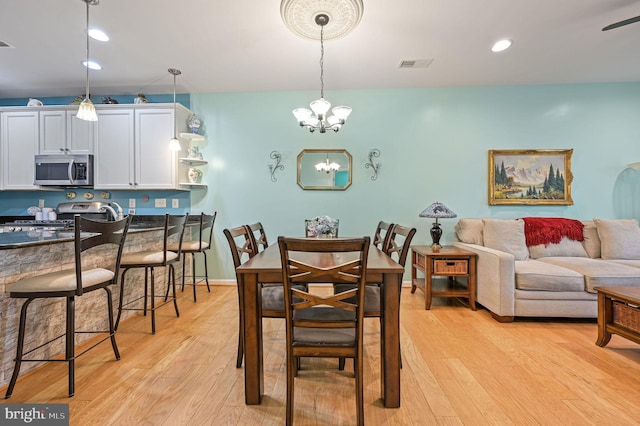 147 Candor Ln, Dover, DE 19901 - dining space with light wood-type flooring, a chandelier, and recessed lighting