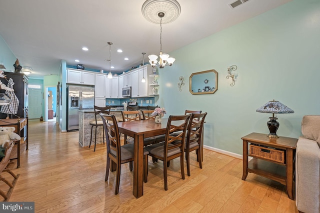 147 Candor Ln, Dover, DE 19901 - dining area featuring light wood-style flooring, a chandelier, and recessed lighting