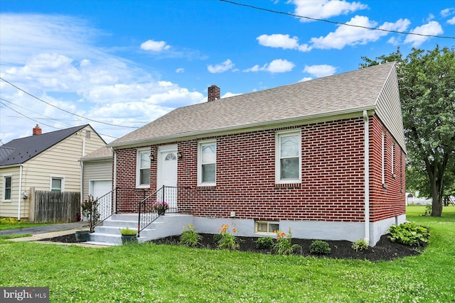 522 E Simpson St, Mechanicsburg, PA 17055 - view of front of house with a chimney, a garage, brick siding, and roof with shingles