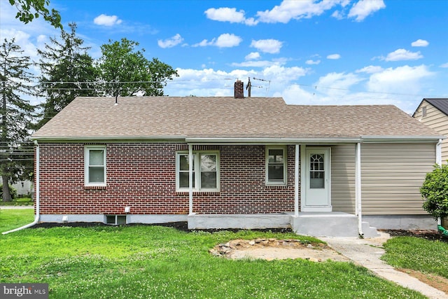 522 E Simpson St, Mechanicsburg, PA 17055 - rear view of house featuring a chimney, a yard, roof with shingles, and brick siding