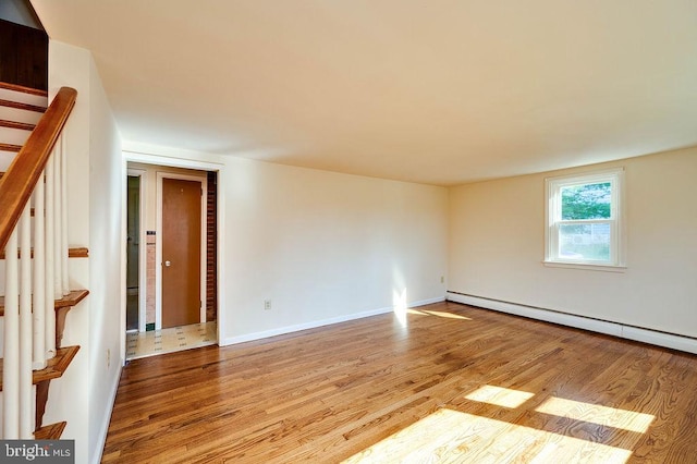 416 Colebrookdale Rd, Boyertown, PA 19512 - spare room with baseboard heating, wood finished floors, and stairs