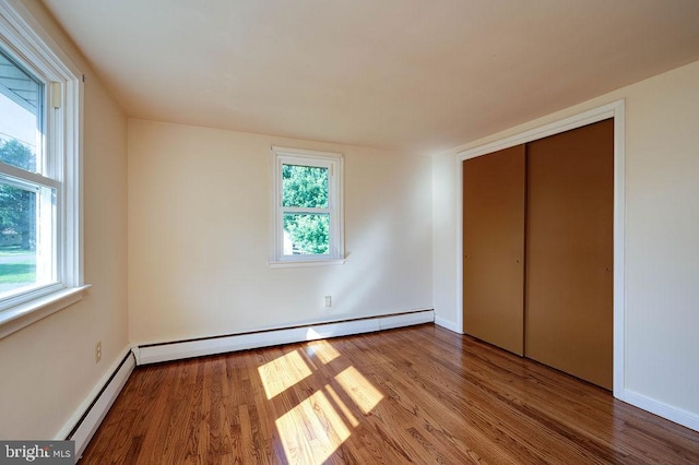 416 Colebrookdale Rd, Boyertown, PA 19512 - unfurnished bedroom with baseboard heating, wood finished floors, and a closet