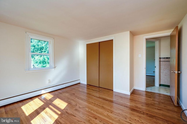 416 Colebrookdale Rd, Boyertown, PA 19512 - unfurnished bedroom with a baseboard radiator, light wood-type flooring, and a closet