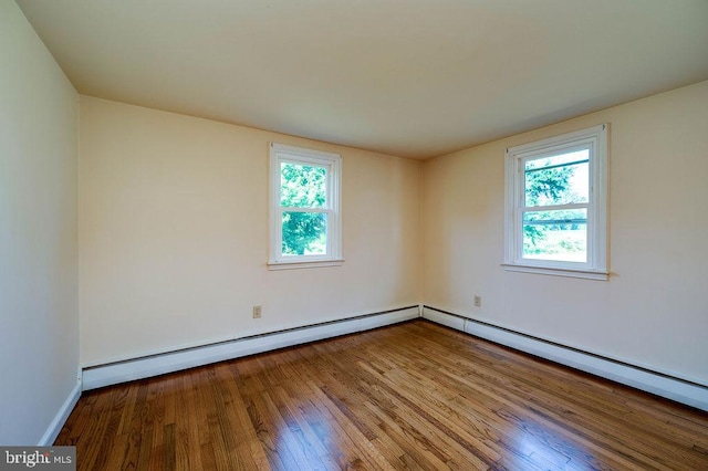 416 Colebrookdale Rd, Boyertown, PA 19512 - empty room featuring hardwood / wood-style floors, healthy amount of natural light, and a baseboard radiator