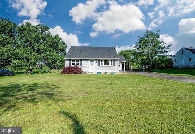 416 Colebrookdale Rd, Boyertown, PA 19512 - new england style home featuring a front yard, a chimney, and asphalt driveway