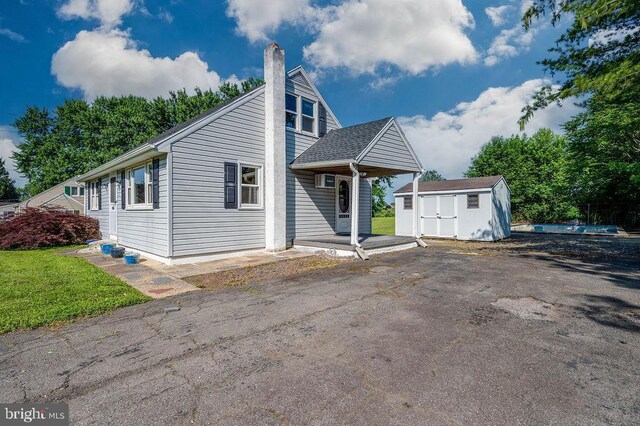 416 Colebrookdale Rd, Boyertown, PA 19512 - view of front facade featuring a shed and a chimney