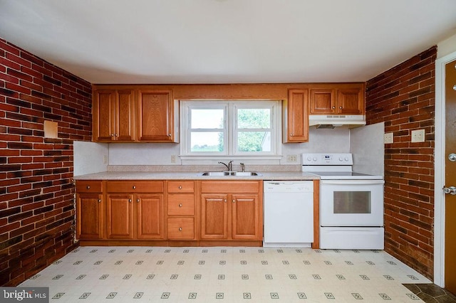 416 Colebrookdale Rd, Boyertown, PA 19512 - kitchen with white appliances, brick wall, under cabinet range hood, light countertops, and brown cabinetry
