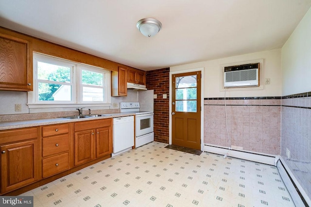 416 Colebrookdale Rd, Boyertown, PA 19512 - kitchen with white appliances, under cabinet range hood, healthy amount of natural light, a baseboard radiator, and wainscoting