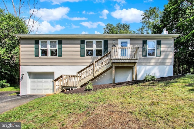 4953 Lincolnwood Dr, York, PA 17408 - view of front of property featuring stairs, a garage, a front lawn, and asphalt driveway