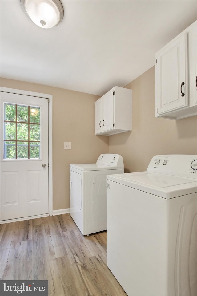 4953 Lincolnwood Dr, York, PA 17408 - laundry room with cabinet space, washer and dryer, and light wood-style flooring
