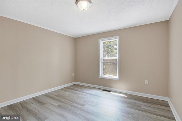 4953 Lincolnwood Dr, York, PA 17408 - empty room featuring wood finished floors, a textured ceiling, and ornamental molding