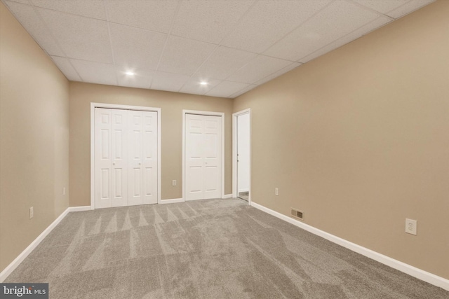 4953 Lincolnwood Dr, York, PA 17408 - unfurnished bedroom featuring multiple closets, a paneled ceiling, carpet floors, and recessed lighting