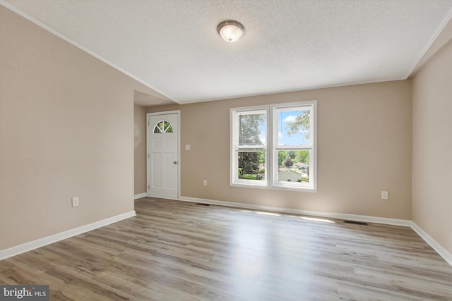 4953 Lincolnwood Dr, York, PA 17408 - empty room with a textured ceiling and wood finished floors