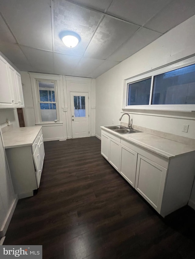 408 Broadway St, Cumberland, MD 21502 - kitchen with dark wood finished floors, a paneled ceiling, light countertops, and white cabinets
