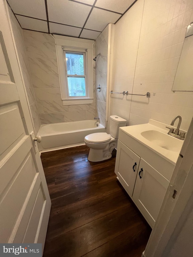 408 Broadway St, Cumberland, MD 21502 - bathroom featuring vanity, wood finished floors, bathing tub / shower combination, and a drop ceiling