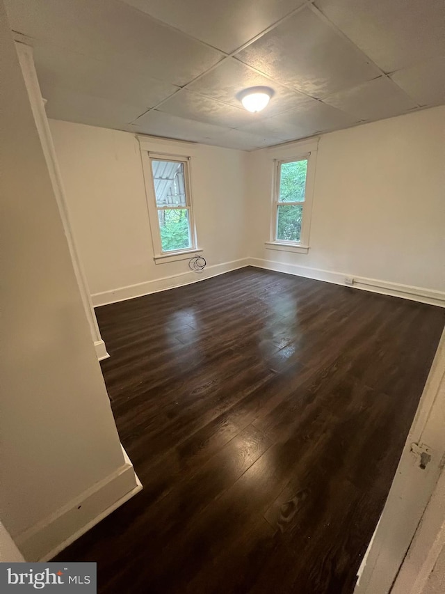 408 Broadway St, Cumberland, MD 21502 - empty room featuring a drop ceiling and dark wood-style flooring