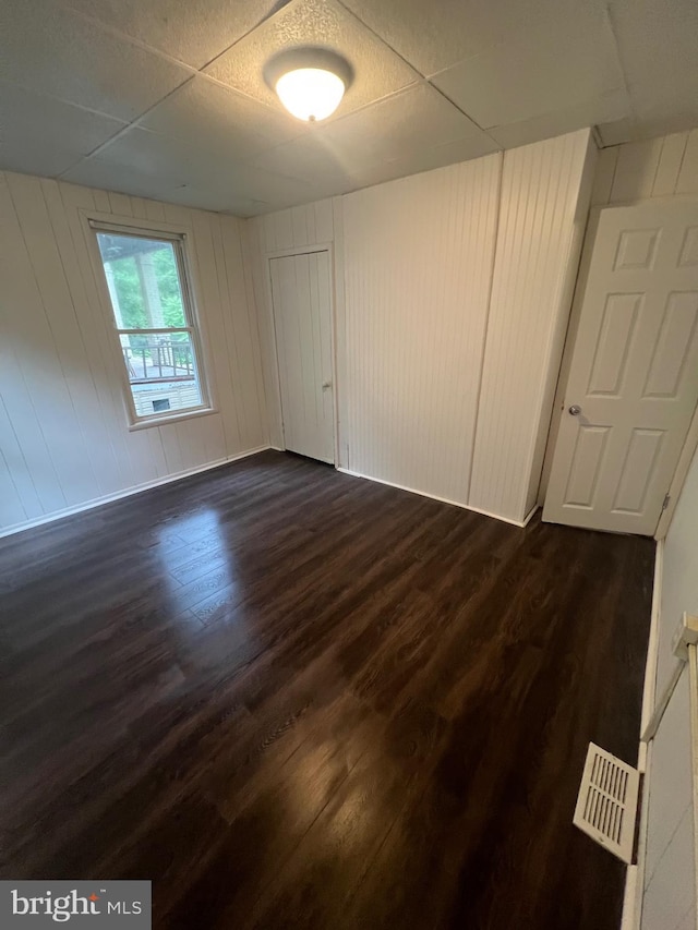 408 Broadway St, Cumberland, MD 21502 - unfurnished bedroom featuring dark wood-type flooring and a paneled ceiling