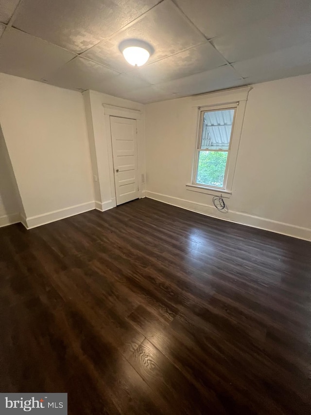 408 Broadway St, Cumberland, MD 21502 - spare room with a paneled ceiling and dark wood-type flooring