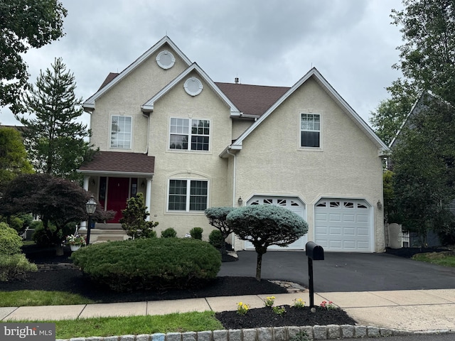 107 Hidden Ct, New Hope, PA 18938 - traditional home featuring concrete driveway, an attached garage, and stucco siding