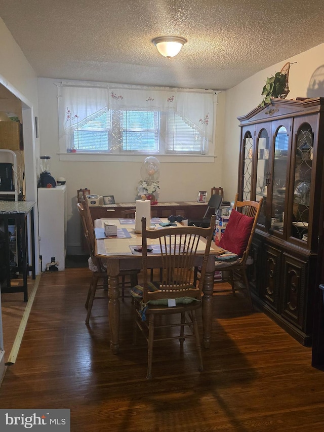 306 E Queen Ln, Philadelphia, PA 19144 - dining space featuring a textured ceiling and wood finished floors