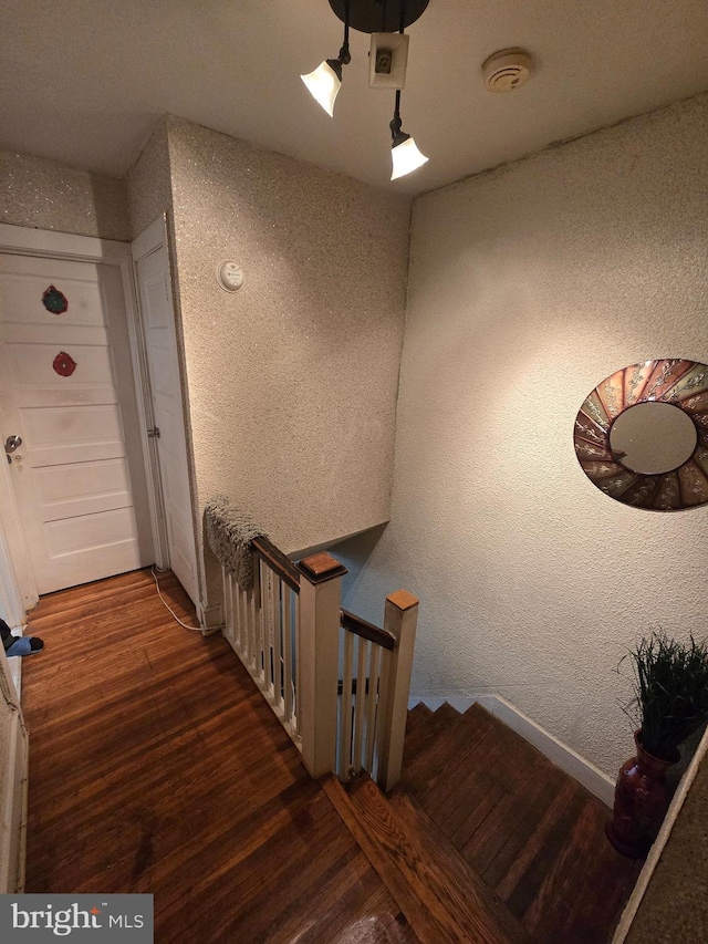 306 E Queen Ln, Philadelphia, PA 19144 - stairway with a textured wall and wood finished floors