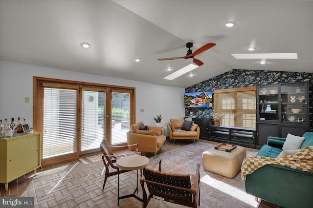 208 Queens Gate Rd, Lititz, PA 17543 - living room with vaulted ceiling, brick patterned floors, a skylight, a ceiling fan, and plenty of natural light