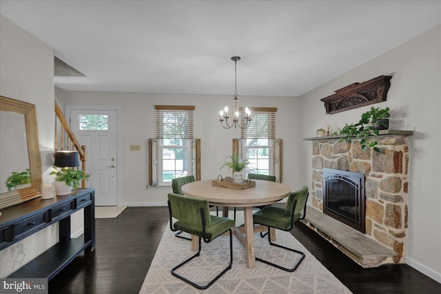 208 Queens Gate Rd, Lititz, PA 17543 - dining area with a chandelier, wood finished floors, and a fireplace