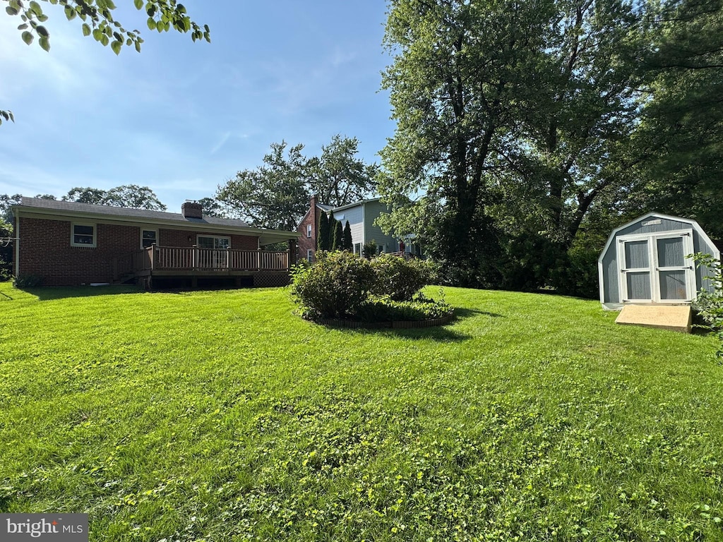 10021 Dallas Ave, Silver Spring, MD 20901 - view of grassy yard featuring a storage shed and a deck