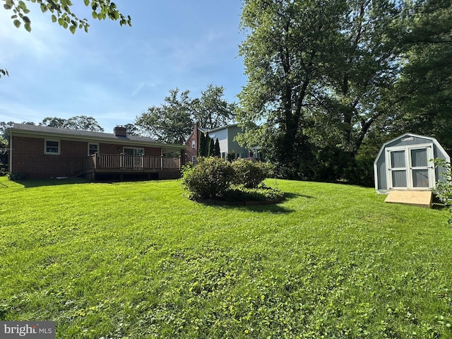 10021 Dallas Ave, Silver Spring, MD 20901 - view of grassy yard featuring a storage shed and a deck