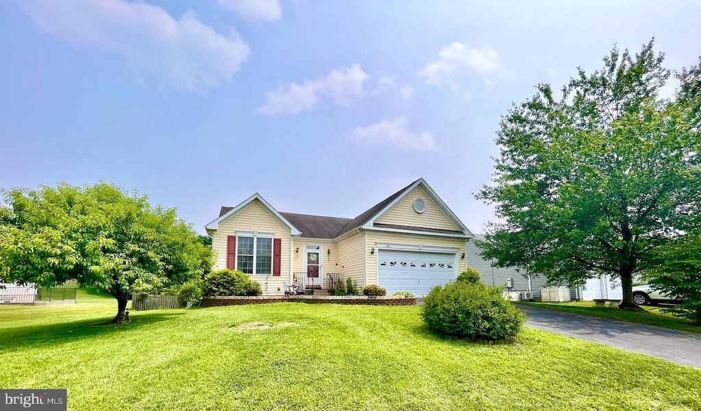 1141 Virginia Ave, Culpeper, VA 22701 - view of front of house with asphalt driveway, a garage, and a front lawn