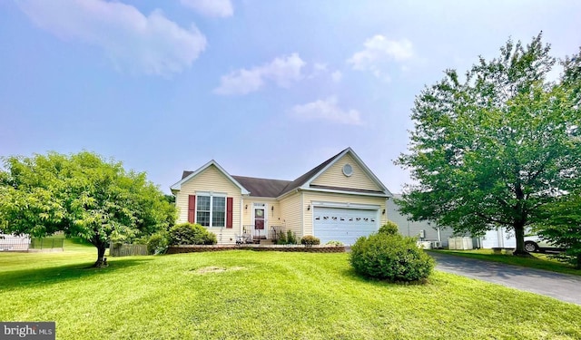 1141 Virginia Ave, Culpeper, VA 22701 - view of front of house with asphalt driveway, a garage, and a front lawn
