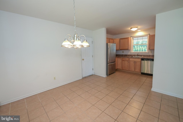 2 Broadale Rd, Doylestown, PA 18901 - kitchen with appliances with stainless steel finishes, a chandelier, dark countertops, light tile patterned flooring, and decorative light fixtures